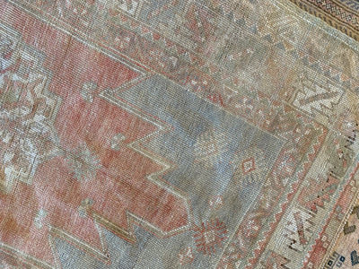 Close up on a red & orange small Bor Turkish Rug.
