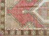 Corner border and motif work on a small red & orange Cal Turkish rug.