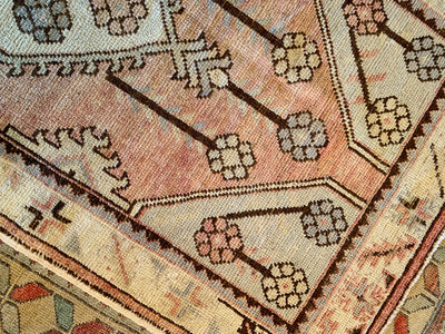 Primary motif pattern on a small red & orange Turkish rug.
