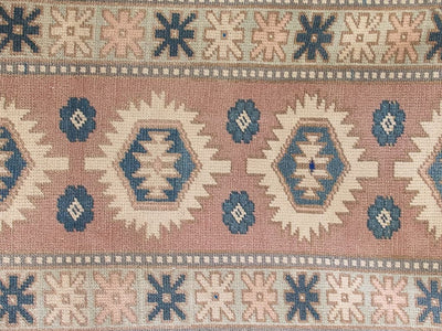 Central features on red & orange varosha Turkish rug runner.