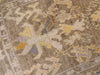 Close up of corner emblem on brown and grey Turkish runner rug.