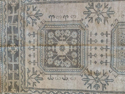Top section of a brown & grey Turkish oushak runner.